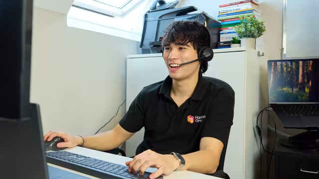 Hamilton Group technician providing remote IT support from the office.