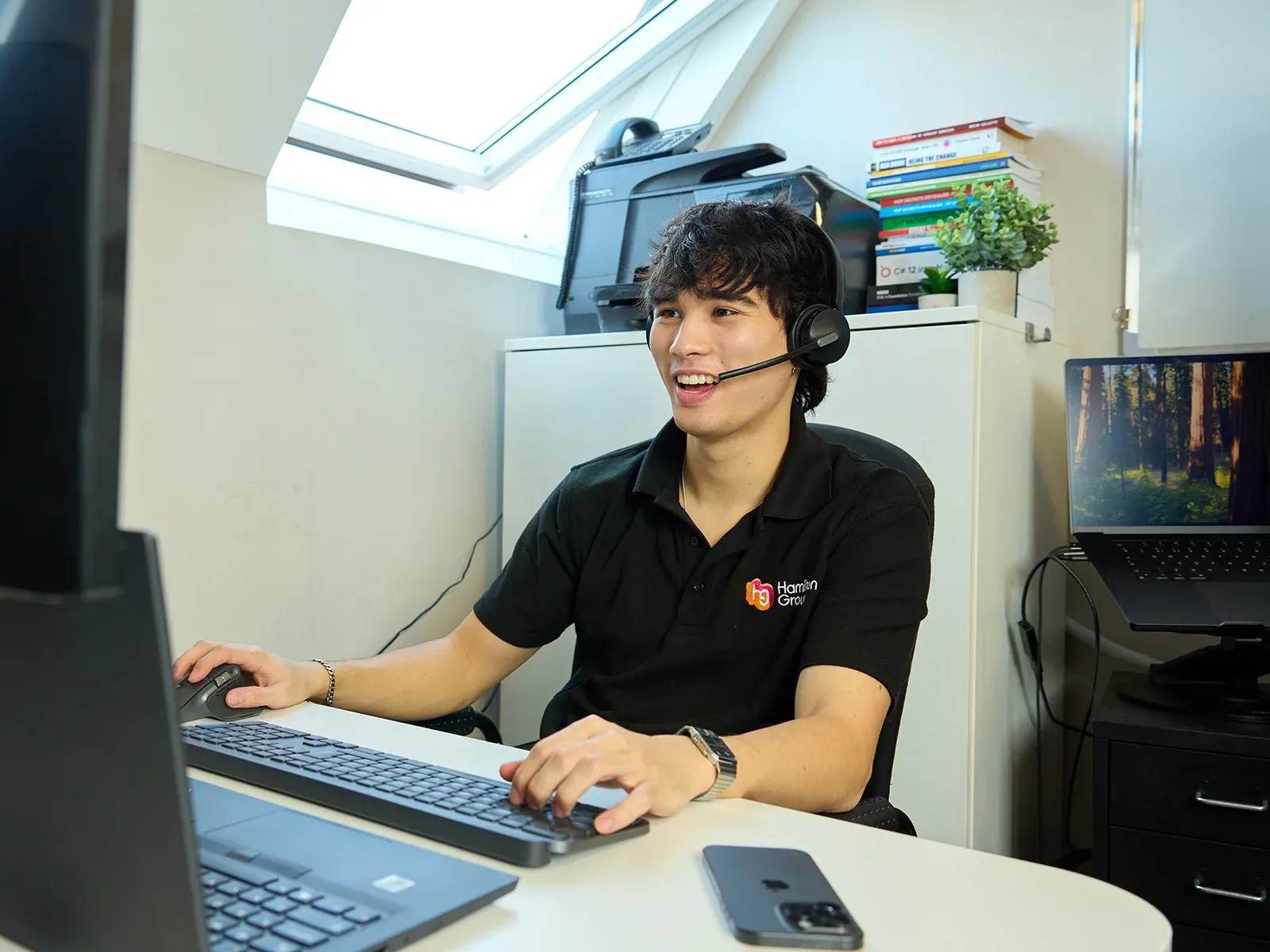 Hamilton Group technician providing remote IT support from the office.